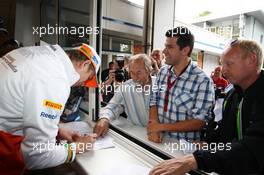 Nico Hulkenberg (GER) Sahara Force India F1 signs autographs for the fans at the ticket office. 19.07.2012. Formula 1 World Championship, Rd 10, German Grand Prix, Hockenheim, Germany, Preparation Day