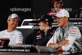 (L to R): Nico Rosberg (GER) Mercedes AMG F1 with Sebastian Vettel (GER) Red Bull Racing and Michael Schumacher (GER) Mercedes AMG F1 in the FIA Press Conference. 19.07.2012. Formula 1 World Championship, Rd 10, German Grand Prix, Hockenheim, Germany, Preparation Day