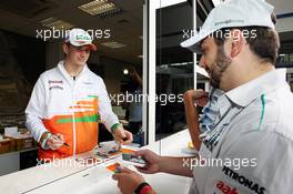 Nico Hulkenberg (GER) Sahara Force India F1 signs autographs for the fans at the ticket office. 19.07.2012. Formula 1 World Championship, Rd 10, German Grand Prix, Hockenheim, Germany, Preparation Day