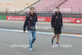(L to R): Sebastian Vettel (GER) Red Bull Racing walks the circuit with Guillaume Rocquelin  (ITA) Red Bull Racing Race Engineer. 19.07.2012. Formula 1 World Championship, Rd 10, German Grand Prix, Hockenheim, Germany, Preparation Day