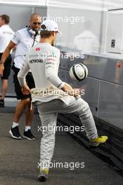 Nico Rosberg (GER) Mercedes AMG F1 practices his football juggling skills with Daniel Schloesser (GER) Personal Trainer. 27.07.2012. Formula 1 World Championship, Rd 11, Hungarian Grand Prix, Budapest, Hungary, Practice Day