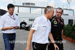 (L to R): Toto Wolff (GER) Williams Non Executive Director; Martin Whitmarsh (GBR) McLaren Chief Executive Officer and Eric Boullier (FRA) Lotus F1 Team Principal head to a meeting with Bernie Ecclestone (GBR) CEO Formula One Group (FOM). 27.07.2012. Formula 1 World Championship, Rd 11, Hungarian Grand Prix, Budapest, Hungary, Practice Day