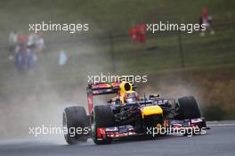 Mark Webber (AUS) Red Bull Racing RB8 in the wet. 27.07.2012. Formula 1 World Championship, Rd 11, Hungarian Grand Prix, Budapest, Hungary, Practice Day