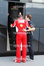 (L to R): Stefano Domenicali (ITA) Ferrari General Director and Christian Horner (GBR) Red Bull Racing Team Principal head for a meeting with Bernie Ecclestone (GBR) CEO Formula One Group (FOM). 27.07.2012. Formula 1 World Championship, Rd 11, Hungarian Grand Prix, Budapest, Hungary, Practice Day