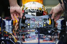 Sebastian Vettel (GER) Red Bull Racing RB8 receives his steering wheel. 27.07.2012. Formula 1 World Championship, Rd 11, Hungarian Grand Prix, Budapest, Hungary, Practice Day