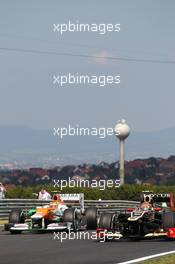 (L to R): Jules Bianchi (FRA) Sahara Force India F1 Team VJM05 Third Driver with Romain Grosjean (FRA) Lotus F1 E20. 27.07.2012. Formula 1 World Championship, Rd 11, Hungarian Grand Prix, Budapest, Hungary, Practice Day