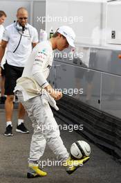 Nico Rosberg (GER) Mercedes AMG F1 practices his football juggling skills with Daniel Schloesser (GER) Personal Trainer. 27.07.2012. Formula 1 World Championship, Rd 11, Hungarian Grand Prix, Budapest, Hungary, Practice Day