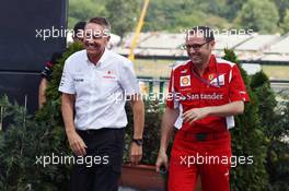 (L to R): Martin Whitmarsh (GBR) McLaren Chief Executive Officer and Stefano Domenicali (ITA) Ferrari General Director leave a meeting with Bernie Ecclestone (GBR) CEO Formula One Group (FOM). 27.07.2012. Formula 1 World Championship, Rd 11, Hungarian Grand Prix, Budapest, Hungary, Practice Day