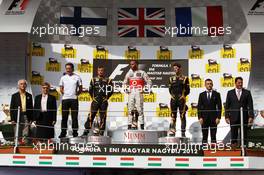 The podium (L to R): Kimi Raikkonen (FIN) Lotus F1 Team, second; Lewis Hamilton (GBR) McLaren, race winner; Romain Grosjean (FRA) Lotus F1 Team, third. 29.07.2012. Formula 1 World Championship, Rd 11, Hungarian Grand Prix, Budapest, Hungary, Race Day