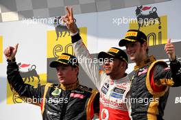 1st place Lewis Hamilton (GBR), McLaren Mercedes with 2nd place Kimi Raikkonen, Lotus Renault F1 Team and 3rd place Romain Grosjean (FRA), Lotus Renault F1 Team  29.07.2012. Formula 1 World Championship, Rd 11, Hungarian Grand Prix, Budapest, Hungary, Race Day