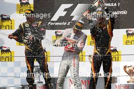 The podium (L to R): Kimi Raikkonen (FIN) Lotus F1 Team, second; Lewis Hamilton (GBR) McLaren, race winner; Romain Grosjean (FRA) Lotus F1 Team, third. 29.07.2012. Formula 1 World Championship, Rd 11, Hungarian Grand Prix, Budapest, Hungary, Race Day