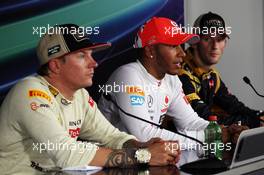 The FIA Press Conference (L to R): Kimi Raikkonen (FIN) Lotus F1 Team, second; Lewis Hamilton (GBR) McLaren, race winner; Romain Grosjean (FRA) Lotus F1 Team, third. 29.07.2012. Formula 1 World Championship, Rd 11, Hungarian Grand Prix, Budapest, Hungary, Race Day