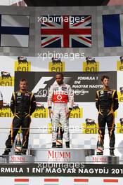 The podium (L to R): Kimi Raikkonen (FIN) Lotus F1 Team, second; Lewis Hamilton (GBR) McLaren, race winner; Romain Grosjean (FRA) Lotus F1 Team, third. 29.07.2012. Formula 1 World Championship, Rd 11, Hungarian Grand Prix, Budapest, Hungary, Race Day