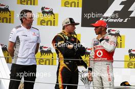 The podium (L to R): Sam Michael (AUS) McLaren Sporting Director with second placed Kimi Raikkonen (FIN) Lotus F1 Team and Lewis Hamilton (GBR) McLaren. 29.07.2012. Formula 1 World Championship, Rd 11, Hungarian Grand Prix, Budapest, Hungary, Race Day