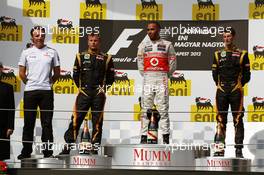 The podium (L to R): Kimi Raikkonen (FIN) Lotus F1 Team, second; Lewis Hamilton (GBR) McLaren, race winner; Romain Grosjean (FRA) Lotus F1 Team, third. 29.07.2012. Formula 1 World Championship, Rd 11, Hungarian Grand Prix, Budapest, Hungary, Race Day