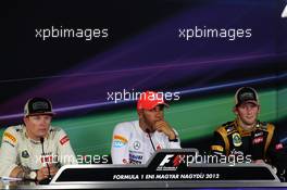 The FIA Press Conference (L to R): Kimi Raikkonen (FIN) Lotus F1 Team, second; Lewis Hamilton (GBR) McLaren, race winner; Romain Grosjean (FRA) Lotus F1 Team, third. 29.07.2012. Formula 1 World Championship, Rd 11, Hungarian Grand Prix, Budapest, Hungary, Race Day