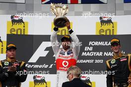 The podium (L to R): Kimi Raikkonen (FIN) Lotus F1 Team, second; Lewis Hamilton (GBR) McLaren, race winner; Romain Grosjean (FRA) Lotus F1 Team, third. 29.07.2012. Formula 1 World Championship, Rd 11, Hungarian Grand Prix, Budapest, Hungary, Race Day