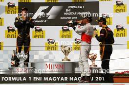 The podium (L to R): Kimi Raikkonen (FIN) Lotus F1 Team, second; Lewis Hamilton (GBR) McLaren, race winner; Romain Grosjean (FRA) Lotus F1 Team, third. 29.07.2012. Formula 1 World Championship, Rd 11, Hungarian Grand Prix, Budapest, Hungary, Race Day