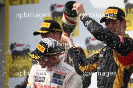 1st place Lewis Hamilton (GBR), McLaren Mercedes with 3rd place Romain Grosjean (FRA), Lotus Renault F1 Team  29.07.2012. Formula 1 World Championship, Rd 11, Hungarian Grand Prix, Budapest, Hungary, Race Day