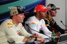 The FIA Press Conference (L to R): Kimi Raikkonen (FIN) Lotus F1 Team, second; Lewis Hamilton (GBR) McLaren, race winner; Romain Grosjean (FRA) Lotus F1 Team, third. 29.07.2012. Formula 1 World Championship, Rd 11, Hungarian Grand Prix, Budapest, Hungary, Race Day