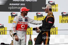 The podium (L to R): Race winner Lewis Hamilton (GBR) McLaren with third placed Romain Grosjean (FRA) Lotus F1 Team. 29.07.2012. Formula 1 World Championship, Rd 11, Hungarian Grand Prix, Budapest, Hungary, Race Day