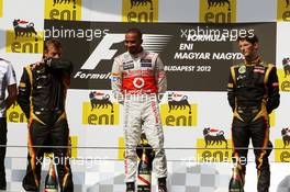 The podium (L to R): Kimi Raikkonen (FIN) Lotus F1 Team, second; Lewis Hamilton (GBR) McLaren, race winner; Romain Grosjean (FRA) Lotus F1 Team, third. 29.07.2012. Formula 1 World Championship, Rd 11, Hungarian Grand Prix, Budapest, Hungary, Race Day