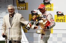 Race winner Lewis Hamilton (GBR) McLaren celebrates on the podium with Placido Domingo (ESP). 29.07.2012. Formula 1 World Championship, Rd 11, Hungarian Grand Prix, Budapest, Hungary, Race Day
