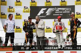 The podium (L to R): Sam Michael (AUS) McLaren Sporting Director; Kimi Raikkonen (FIN) Lotus F1 Team, second; Placido Domingo (ESP); Lewis Hamilton (GBR) McLaren, race winner; Romain Grosjean (FRA) Lotus F1 Team, third. 29.07.2012. Formula 1 World Championship, Rd 11, Hungarian Grand Prix, Budapest, Hungary, Race Day