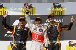 1st place Lewis Hamilton (GBR), McLaren Mercedes with 2nd place Kimi Raikkonen, Lotus Renault F1 Team and 3rd place Romain Grosjean (FRA), Lotus Renault F1 Team  29.07.2012. Formula 1 World Championship, Rd 11, Hungarian Grand Prix, Budapest, Hungary, Race Day