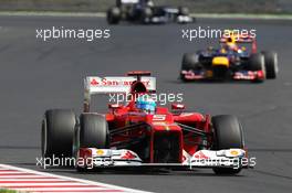 Fernando Alonso (ESP) Ferrari F2012 leads Mark Webber (AUS) Red Bull Racing RB8. 29.07.2012. Formula 1 World Championship, Rd 11, Hungarian Grand Prix, Budapest, Hungary, Race Day