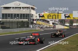 Lewis Hamilton (GBR), McLaren Mercedes leads Kimi Raikkonen, Lotus Renault F1 Team  29.07.2012. Formula 1 World Championship, Rd 11, Hungarian Grand Prix, Budapest, Hungary, Race Day