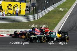 Jean-Eric Vergne (FRA) Scuderia Toro Rosso STR7 and Heikki Kovalainen (FIN) Caterham CT01 battle for position. 29.07.2012. Formula 1 World Championship, Rd 11, Hungarian Grand Prix, Budapest, Hungary, Race Day