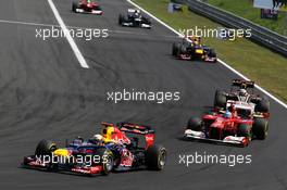 Sebastian Vettel (GER) Red Bull Racing RB8 leads Fernando Alonso (ESP) Ferrari F2012. 29.07.2012. Formula 1 World Championship, Rd 11, Hungarian Grand Prix, Budapest, Hungary, Race Day