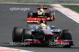 Lewis Hamilton (GBR) McLaren MP4/27 leads Kimi Raikkonen (FIN) Lotus F1 E20. 29.07.2012. Formula 1 World Championship, Rd 11, Hungarian Grand Prix, Budapest, Hungary, Race Day