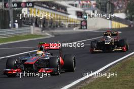 Lewis Hamilton (GBR), McLaren Mercedes leads Kimi Raikkonen, Lotus Renault F1 Team  29.07.2012. Formula 1 World Championship, Rd 11, Hungarian Grand Prix, Budapest, Hungary, Race Day