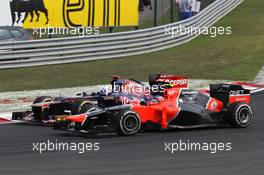 Charles Pic (FRA), Marussia F1 Team and Daniel Ricciardo (AUS), Scuderia Toro Rosso  29.07.2012. Formula 1 World Championship, Rd 11, Hungarian Grand Prix, Budapest, Hungary, Race Day