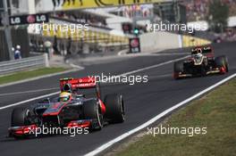Lewis Hamilton (GBR), McLaren Mercedes leads Kimi Raikkonen, Lotus Renault F1 Team  29.07.2012. Formula 1 World Championship, Rd 11, Hungarian Grand Prix, Budapest, Hungary, Race Day
