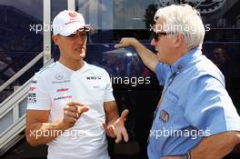(L to R): Michael Schumacher (GER) Mercedes AMG F1 with Charlie Whiting (GBR) FIA Delegate. 28.07.2012. Formula 1 World Championship, Rd 11, Hungarian Grand Prix, Budapest, Hungary, Qualifying Day