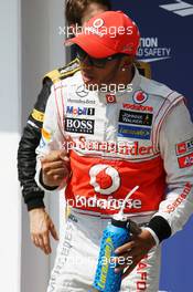 Lewis Hamilton (GBR) McLaren celebrates his pole position in parc ferme. 28.07.2012. Formula 1 World Championship, Rd 11, Hungarian Grand Prix, Budapest, Hungary, Qualifying Day