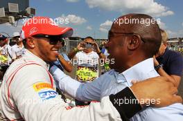 (L to R): Lewis Hamilton (GBR) McLaren celebrates his pole position in parc ferme with father Anthony Hamilton (GBR). 28.07.2012. Formula 1 World Championship, Rd 11, Hungarian Grand Prix, Budapest, Hungary, Qualifying Day