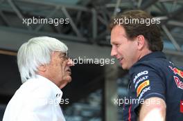 (L to R): Bernie Ecclestone (GBR) CEO Formula One Group (FOM) with Christian Horner (GBR) Red Bull Racing Team Principal. 28.07.2012. Formula 1 World Championship, Rd 11, Hungarian Grand Prix, Budapest, Hungary, Qualifying Day