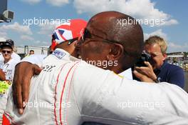 (L to R): Lewis Hamilton (GBR) McLaren celebrates his pole position in parc ferme with father Anthony Hamilton (GBR). 28.07.2012. Formula 1 World Championship, Rd 11, Hungarian Grand Prix, Budapest, Hungary, Qualifying Day