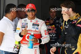 Lewis Hamilton (GBR) McLaren (Left) celebrates his pole position in parc ferme with Romain Grosjean (FRA) Lotus F1 Team and Sebastian Vettel (GER) Red Bull Racing. 28.07.2012. Formula 1 World Championship, Rd 11, Hungarian Grand Prix, Budapest, Hungary, Qualifying Day