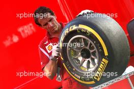 Scuderia Ferrari mechanic, Pirelli tire 28.07.2012. Formula 1 World Championship, Rd 11, Hungarian Grand Prix, Budapest, Hungary, Qualifying Day