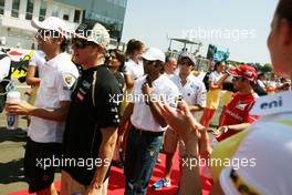 (L to R): Pedro De La Rosa (ESP) HRT Formula 1 Team with Heikki Kovalainen (FIN) Caterham on the drivers parade. 29.07.2012. Formula 1 World Championship, Rd 11, Hungarian Grand Prix, Budapest, Hungary, Race Day