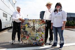 (L to R): Bernie Ecclestone (GBR) CEO Formula One Group (FOM); Peter Gerstl (HUN) Hungarian GP Promoter and the daughter of Tamas Frank (HUN) with a Hungarian Grand Prix montage by artist Mark Dickens. 29.07.2012. Formula 1 World Championship, Rd 11, Hungarian Grand Prix, Budapest, Hungary, Race Day