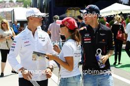 (L to R): Michael Schumacher (GER) Mercedes AMG F1 and Sebastian Vettel (GER) Red Bull Racing with a fan. 29.07.2012. Formula 1 World Championship, Rd 11, Hungarian Grand Prix, Budapest, Hungary, Race Day