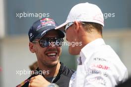 (L to R): Sebastian Vettel (GER) Red Bull Racing with Michael Schumacher (GER) Mercedes AMG F1 on the drivers parade. 29.07.2012. Formula 1 World Championship, Rd 11, Hungarian Grand Prix, Budapest, Hungary, Race Day