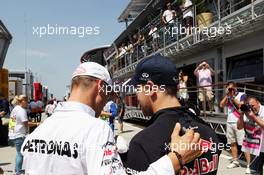 (L to R): Michael Schumacher (GER) Mercedes AMG F1 with Sebastian Vettel (GER) Red Bull Racing. 29.07.2012. Formula 1 World Championship, Rd 11, Hungarian Grand Prix, Budapest, Hungary, Race Day