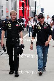 (L to R): Andy Stobart (GBR) Lotus F1 Team Press Officer with Kimi Raikkonen (FIN) Lotus F1 Team. 26.07.2012. Formula 1 World Championship, Rd 11, Hungarian Grand Prix, Budapest, Hungary, Preparation Day